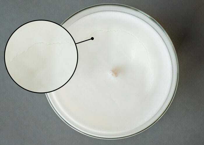 Soy wax candle with a crack circling around the wick.