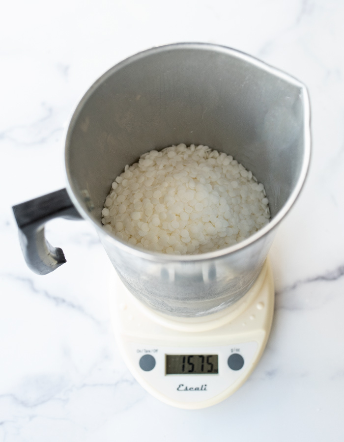 Weighing wax on a digital scale.