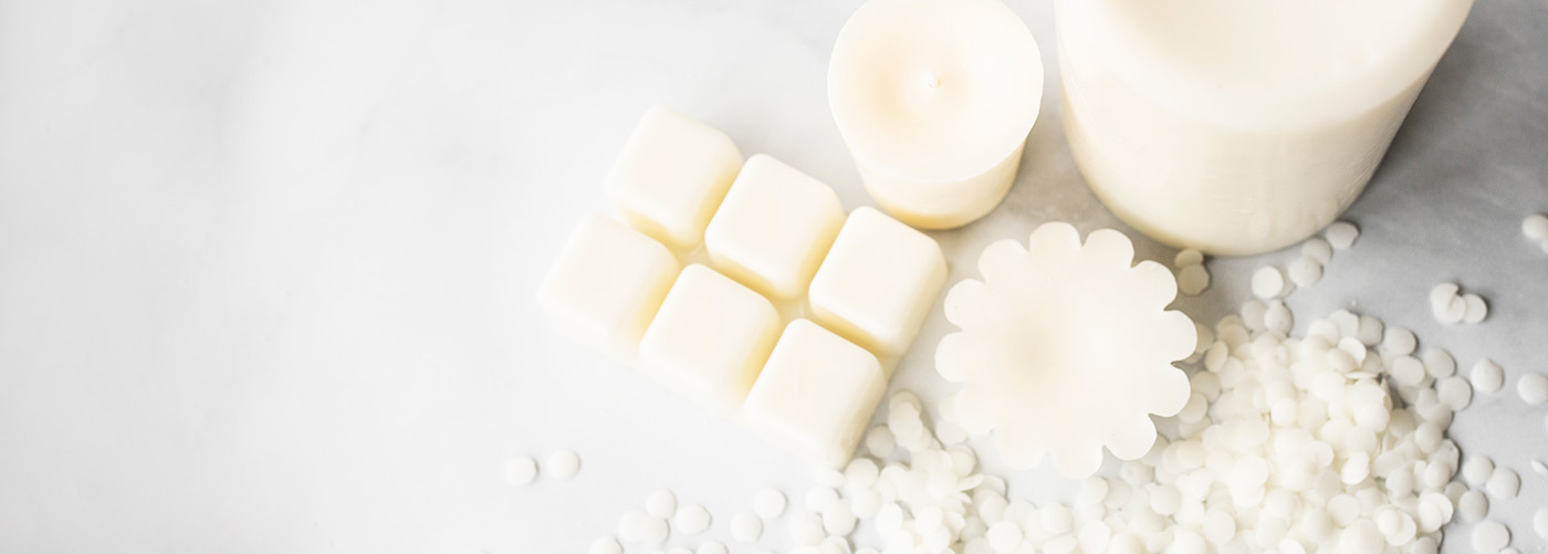 Overhead view of soy wax tarts, wax melts, votives, and pillars.